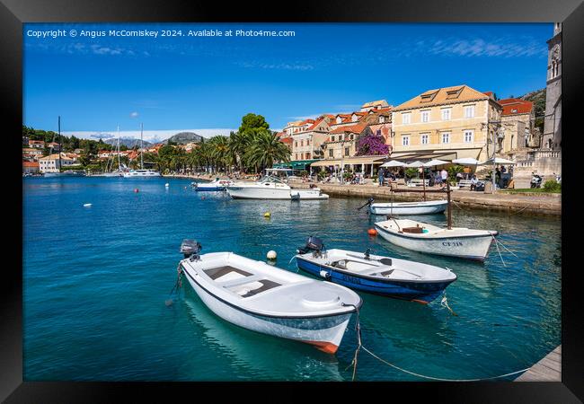 Boats tied up on waterfront of Cavtat in Croatia Framed Print by Angus McComiskey