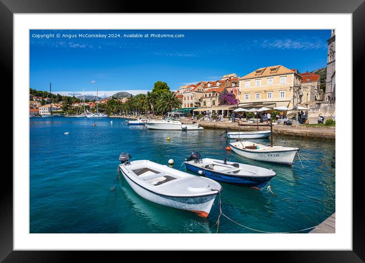 Boats tied up on waterfront of Cavtat in Croatia Framed Mounted Print by Angus McComiskey