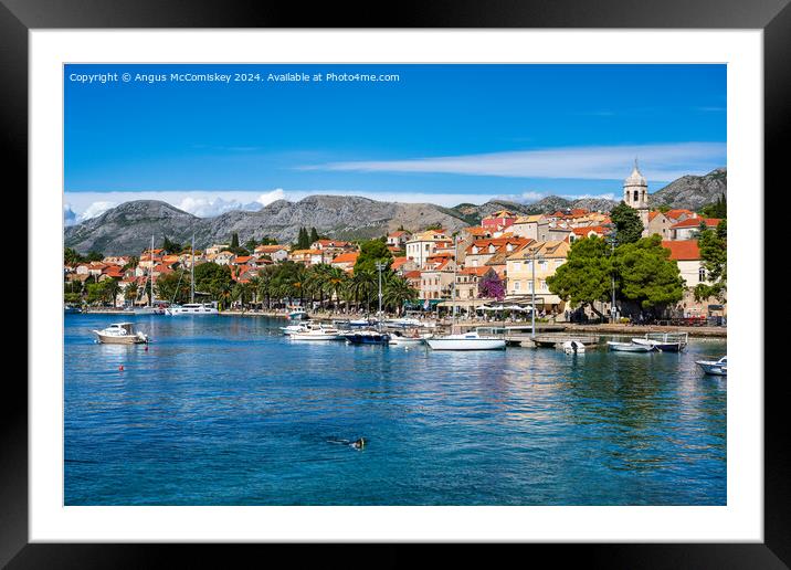 Boats moored in Cavtat harbour in Croatia Framed Mounted Print by Angus McComiskey