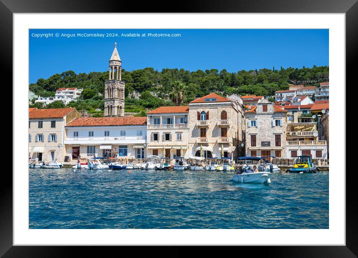 Boats on waterfront of Hvar town, Croatia Framed Mounted Print by Angus McComiskey
