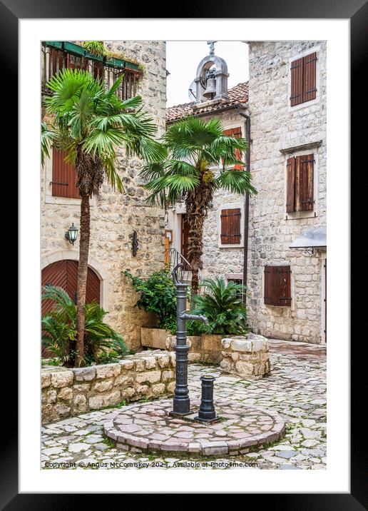 Drinking water tap in old town of Kotor Montenegro Framed Mounted Print by Angus McComiskey