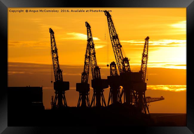 Cranes on the River Clyde at sunset Framed Print by Angus McComiskey