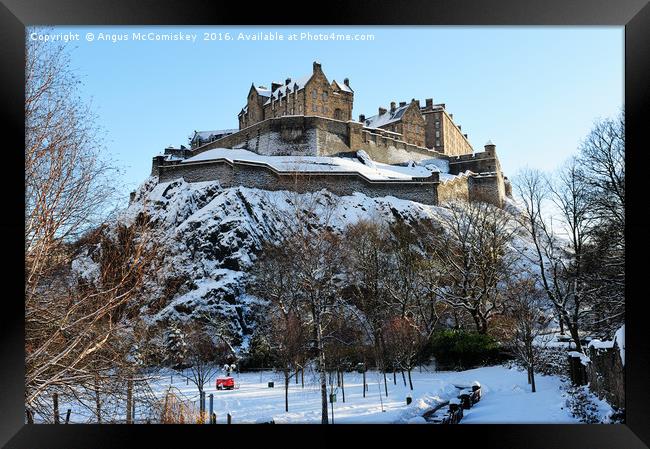 Edinburgh Castle in snow from Princes Street Framed Print by Angus McComiskey