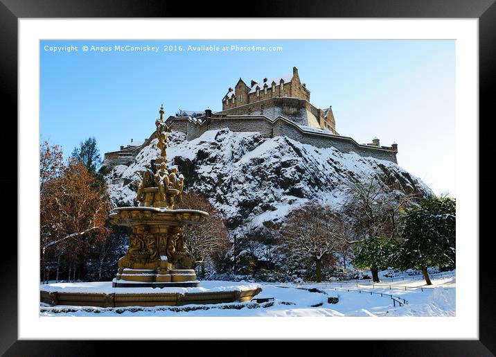 Edinburgh Castle and Ross Fountain in snow Framed Mounted Print by Angus McComiskey