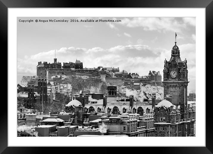 Edinburgh Castle and city skyline in snow mono Framed Mounted Print by Angus McComiskey