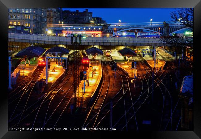 Edinburgh Waverley Station by night Framed Print by Angus McComiskey