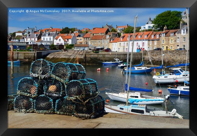 Lobster pots on quayside at St Monans Framed Print by Angus McComiskey