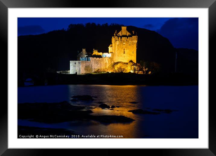 Eilean Donan Castle by night Framed Mounted Print by Angus McComiskey