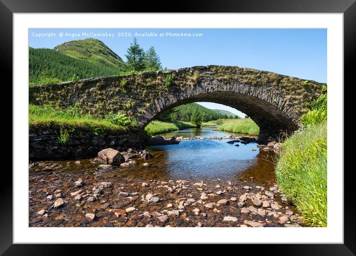Butterbridge old stone single arched bridge Framed Mounted Print by Angus McComiskey