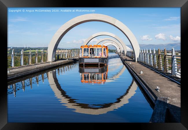 Canal boat leaving Falkirk Wheel Framed Print by Angus McComiskey