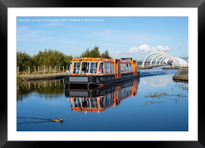 Canal boat leaving Falkirk Wheel behind Framed Mounted Print by Angus McComiskey