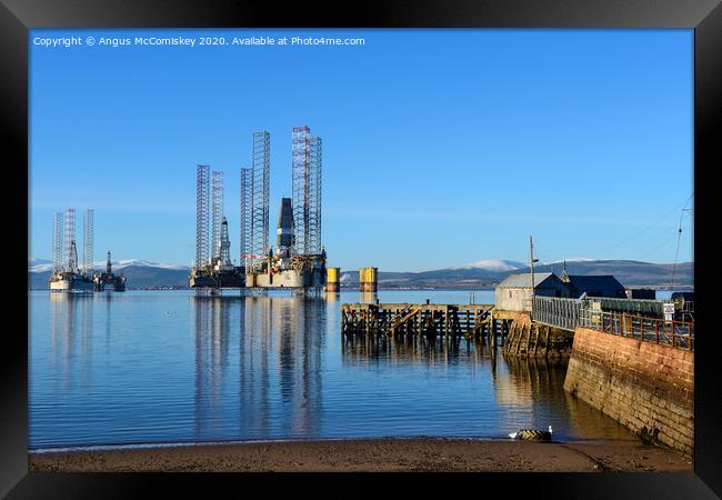 Decommissioned oil rigs off Cromarty harbour Framed Print by Angus McComiskey