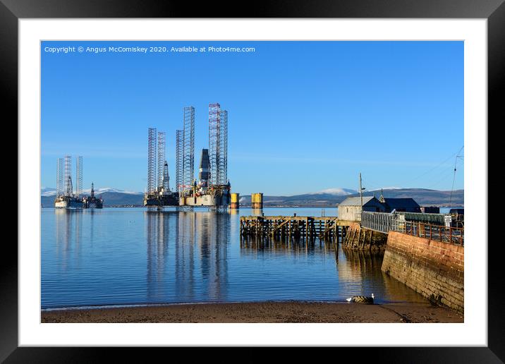 Decommissioned oil rigs off Cromarty harbour Framed Mounted Print by Angus McComiskey