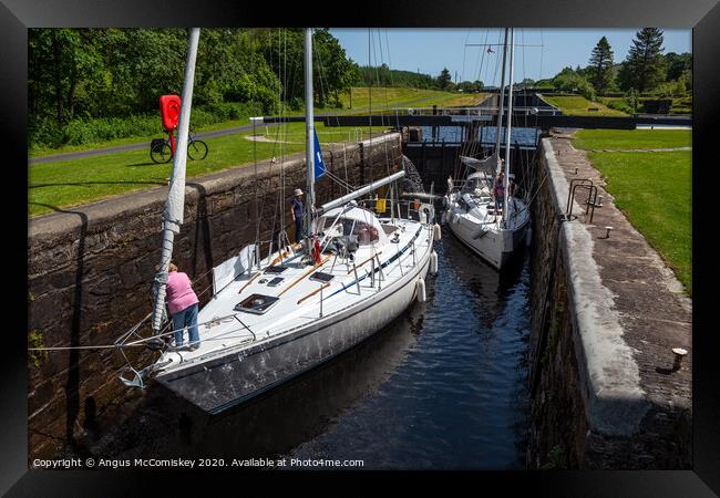 Yachts between locks at Dunardry on Crinan Canal Framed Print by Angus McComiskey