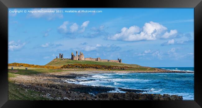 Dunstanburgh Castle Northumberland Framed Print by Angus McComiskey