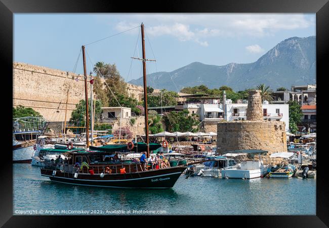 Gullet arriving at Kyrenia harbour Northern Cyprus Framed Print by Angus McComiskey