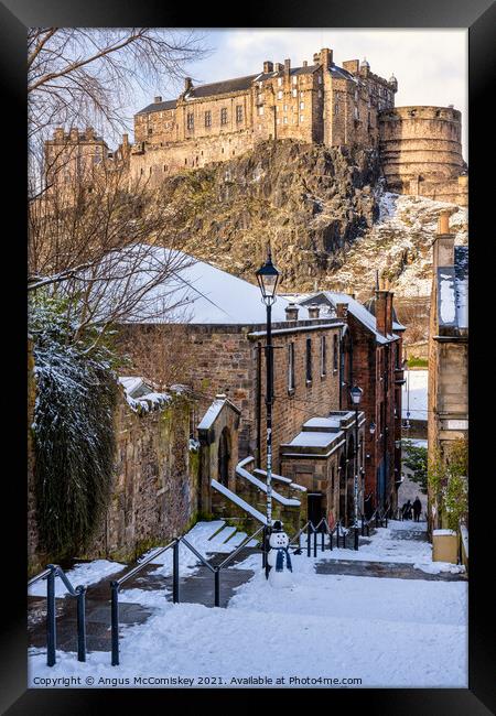Edinburgh Castle from The Vennel with snowman Framed Print by Angus McComiskey
