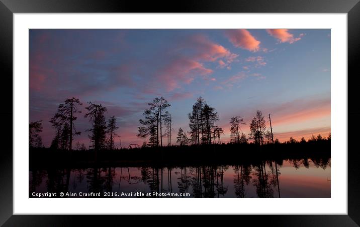 Sunset over the forest in Finland Framed Mounted Print by Alan Crawford