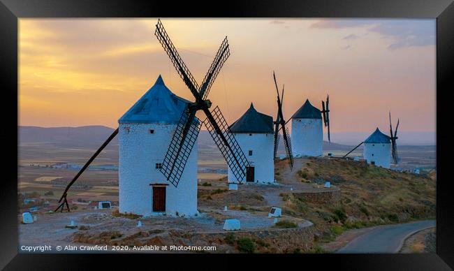 Sunset on the windmills at Consuegra, Spain Framed Print by Alan Crawford