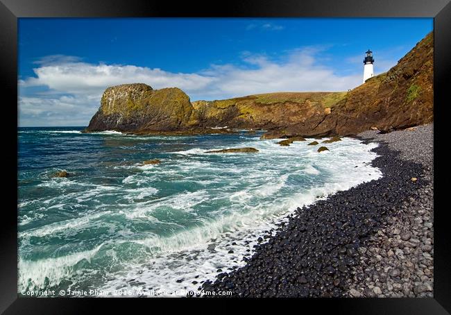 Yaquina Lighthouse on top of rocky beach Framed Print by Jamie Pham