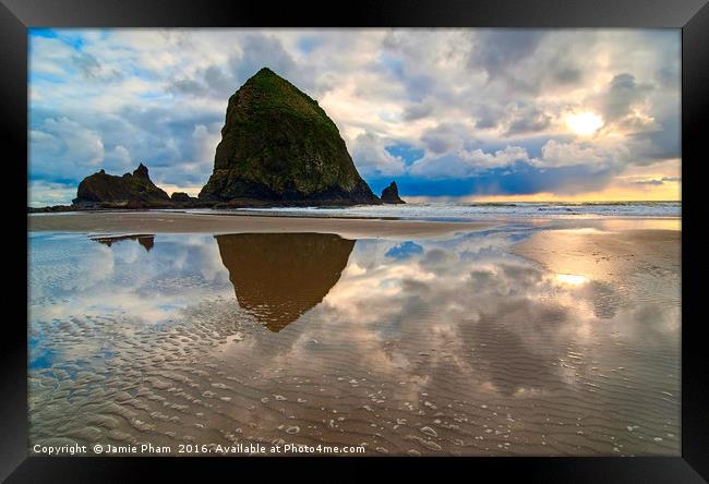 Cannon Beach with storm clouds in Oregon Framed Print by Jamie Pham