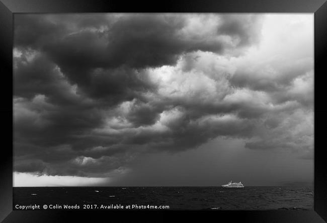 Boat and Approaching Storm Framed Print by Colin Woods