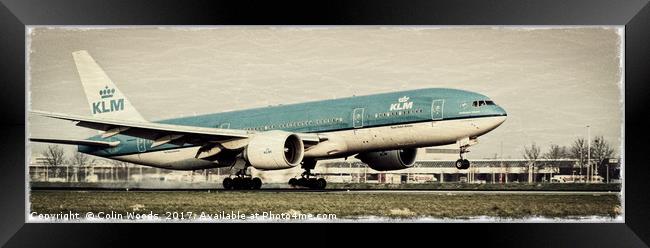 A KLM Boeing 777 landing at Schiphol airport , Ams Framed Print by Colin Woods