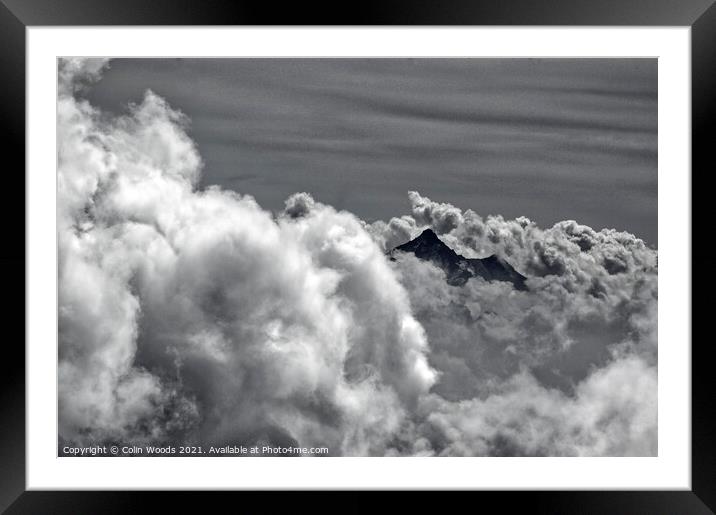 An alpine peak emerges from the clouds Framed Mounted Print by Colin Woods