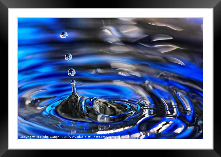 Droplets in Blue Framed Mounted Print by Philip Gough