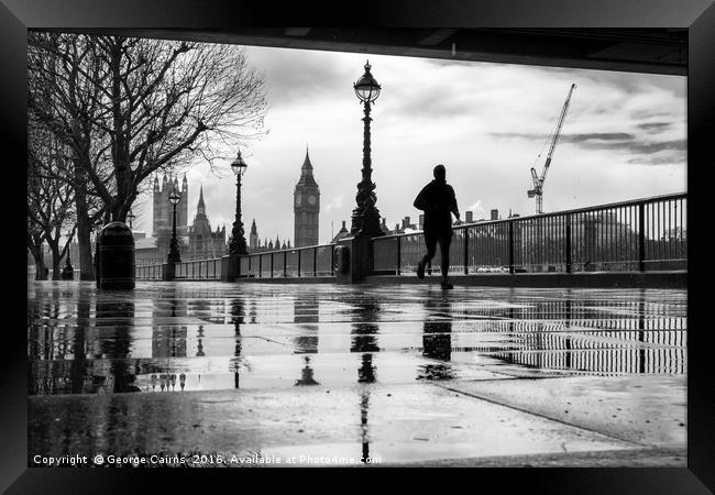 Runner in the Rain Framed Print by George Cairns