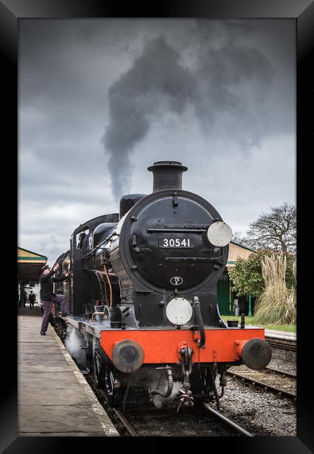 HORSTED KEYNES, UK - MARCH 19, 2016: Driver climbs Framed Print by George Cairns