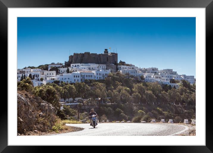PATMOS, GREECE - SEPTEMBER 25, 2016: A moped drive Framed Mounted Print by George Cairns