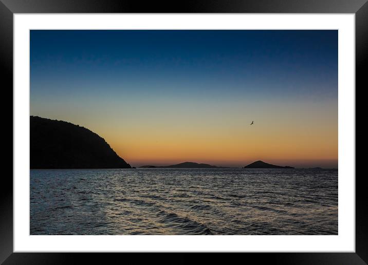 The sun rises over the Greek island of Patmos Framed Mounted Print by George Cairns
