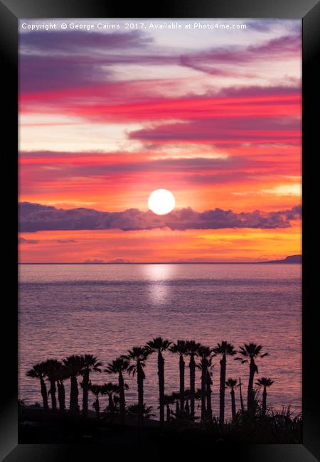 Sunset and silhouettes of the coast of Tenerife Framed Print by George Cairns