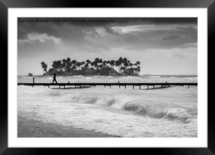 A man walks along a jetty on a stormy day Framed Mounted Print by George Cairns