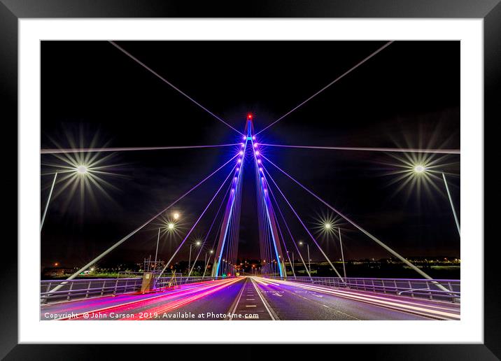 Illuminating the Northern Spire Framed Mounted Print by John Carson