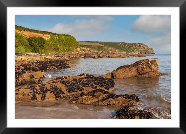A rocky beach at pendower cornwall Framed Mounted Print by Kevin Snelling