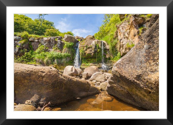 Waterfall framed by rocks Framed Mounted Print by Kevin Snelling