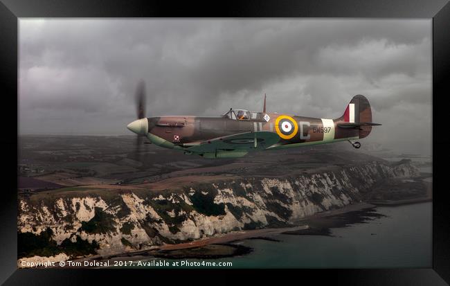 Spitfire over the White Cliffs Framed Print by Tom Dolezal