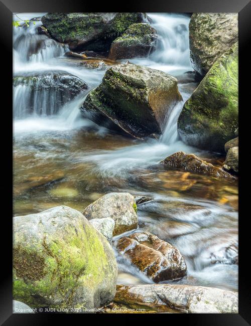 Water over the rocks Framed Print by JUDI LION