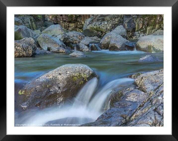 Water flowing over rocks Framed Mounted Print by JUDI LION