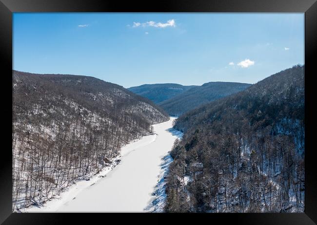 Aerial view up the frozen Cheat River in Morgantown, WV Framed Print by Steve Heap