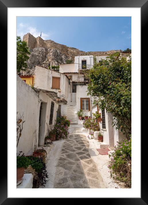 Narrow street in ancient residential district of Anafiotika in A Framed Mounted Print by Steve Heap