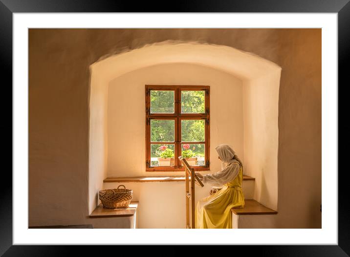 Woman working on embroidery in window alcove Framed Mounted Print by Steve Heap