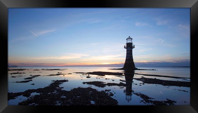 Lighthouse at sunset in silhouette, Framed Print by Jackie Davies