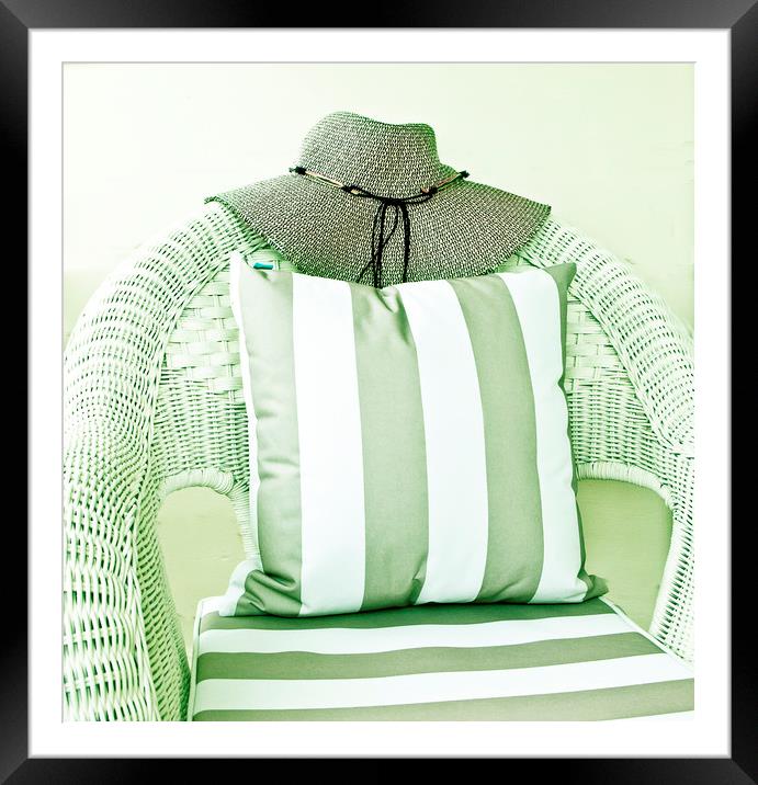 Hat on wicker chair with cushion Framed Mounted Print by David Bigwood