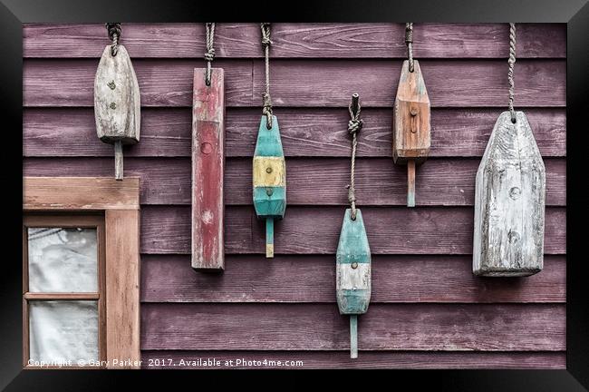 Fishing floats hanging on a wooden wall Framed Print by Gary Parker