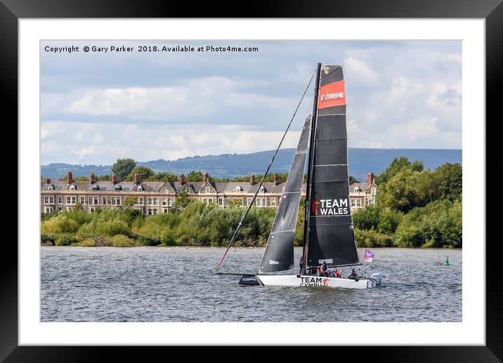 A Team Wales catamaran sails in Cardiff Bay, Wales Framed Mounted Print by Gary Parker