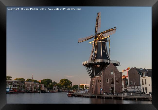 Dutch windmill, in the town of Haarlem, at sunset. Framed Print by Gary Parker