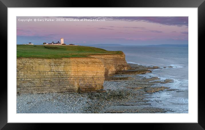 Nash Point lighthouse, south Wales, at sunset. Framed Mounted Print by Gary Parker
